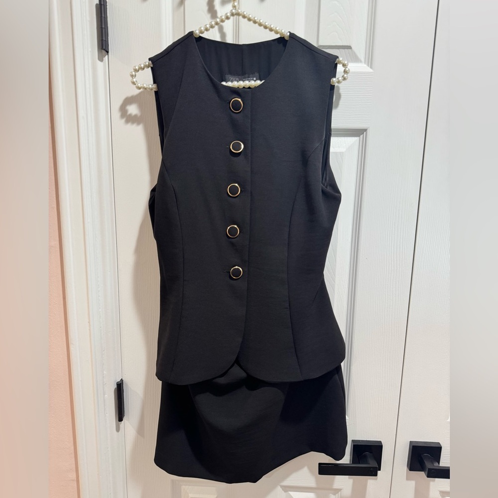 Black Sleeveless Dress with Gold Button Accents